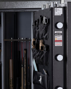 An open Winchester Legacy 53 Fireproof Gun Safe from Winchester Safe showcases multiple firearms and holsters organized with the GunStiXX storage system.